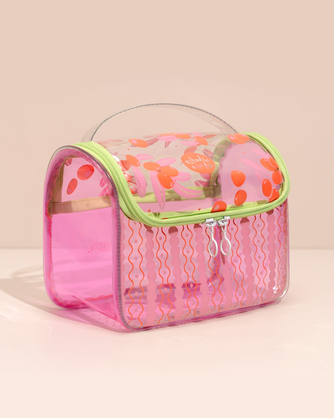 Neceser de Viaje Mediano Orange Olives en vinilo translúcido rosa con estampado frutal y asa superior
