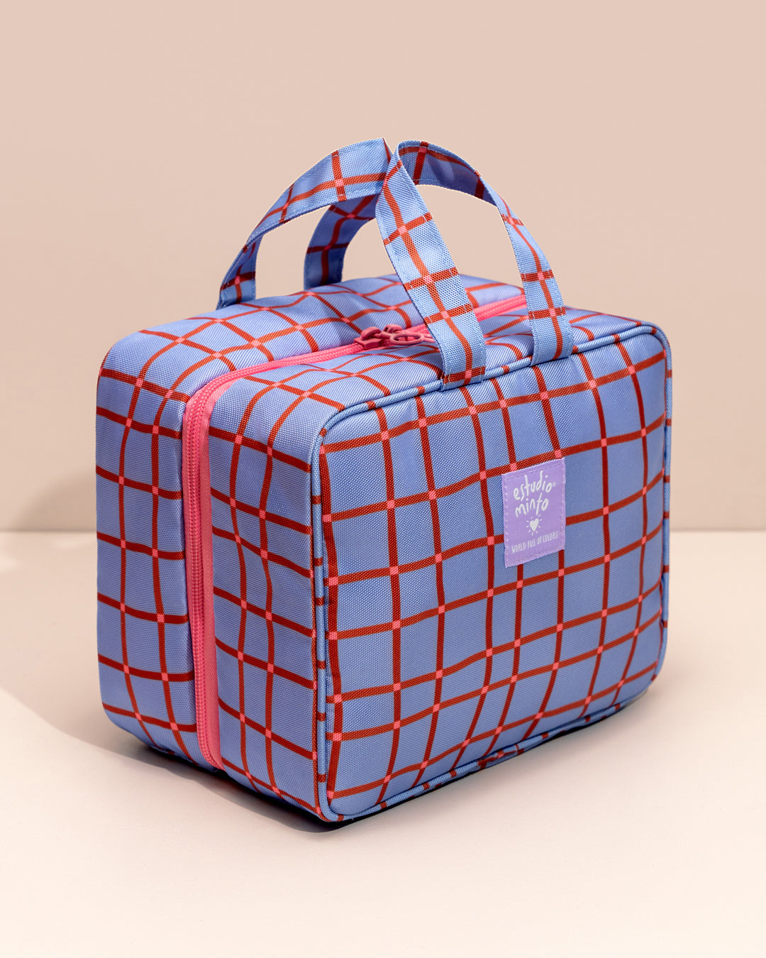 Organizador de Viaje Aster cerrado, con manija y diseño estampado en lona.