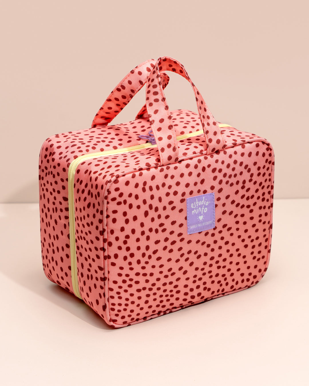 Organizador de Viaje Aster cerrado, con manija y diseño estampado en lona.